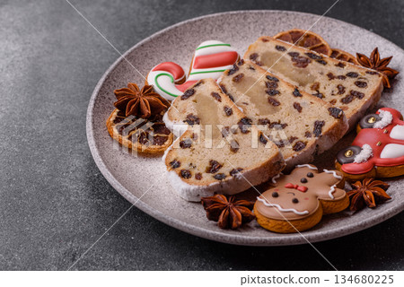 Stollen, a German Christmas pastry for the winter holidays. Stollen as a food background 134680225