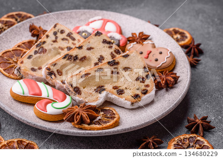 Stollen, a German Christmas pastry for the winter holidays. Stollen as a food background 134680229