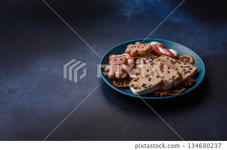 Stollen, a German Christmas pastry for the winter holidays. Stollen as a food background 134680237