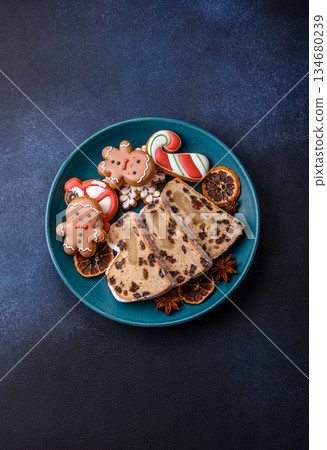 Stollen, a German Christmas pastry for the winter holidays. Stollen as a food background 134680239