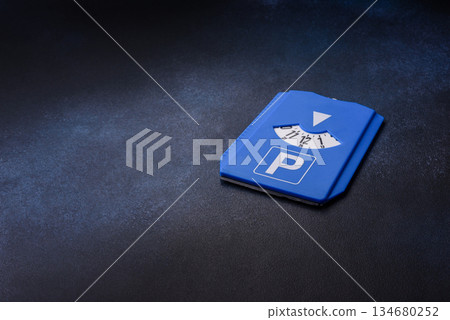 A parking disc, permit, or ticket for measuring time and paying municipal services. A parking disc A parking disc, permit, or ticket for measuring time and paying municipal services. A parking disc 134680252