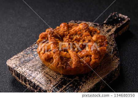 Apple or pumpkin pie or tart is a sweet American autumn treat. American apple pie Apple or pumpkin pie or tart is a sweet American autumn treat. American apple pie 134680350