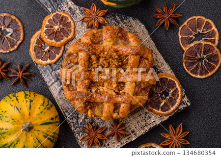 Apple or pumpkin pie or tart is a sweet American autumn treat. American apple pie Apple or pumpkin pie or tart is a sweet American autumn treat. American apple pie 134680354