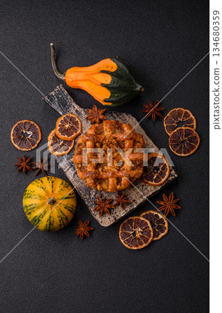 Apple or pumpkin pie or tart is a sweet American autumn treat. American apple pie Apple or pumpkin pie or tart is a sweet American autumn treat. American apple pie 134680359