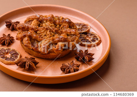 Apple or pumpkin pie or tart is a sweet American autumn treat. American apple pie Apple or pumpkin pie or tart is a sweet American autumn treat. American apple pie 134680369