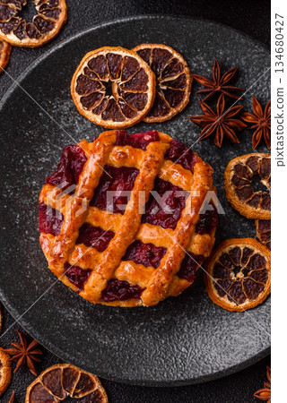 Cherry or strawberry sweet American Christmas pie or tart. American cherry pie 134680427