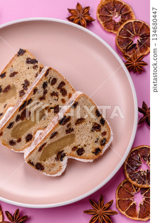 Stollen, a German Christmas pastry for the winter holidays. Stollen as a food background 134680447
