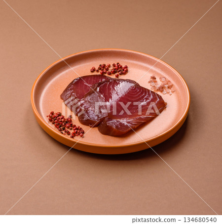 Tuna steak for sashimi or sushi, smoked fish. Tuna steak as a food background 134680540