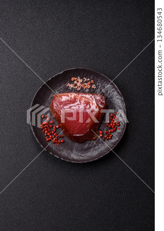 Tuna steak for sashimi or sushi, smoked fish. Tuna steak as a food background 134680543