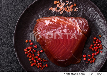 Tuna steak for sashimi or sushi, smoked fish. Tuna steak as a food background 134680546