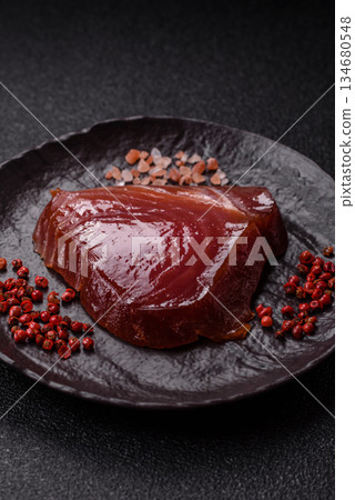 Tuna steak for sashimi or sushi, smoked fish. Tuna steak as a food background 134680548