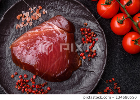 Tuna steak for sashimi or sushi, smoked fish. Tuna steak as a food background 134680550