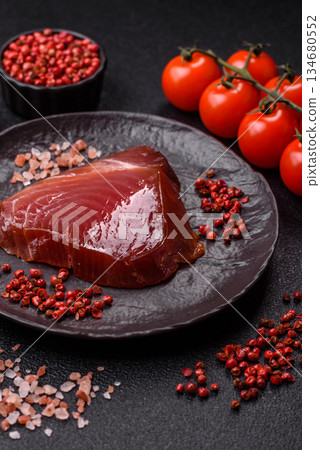 Tuna steak for sashimi or sushi, smoked fish. Tuna steak as a food background 134680552