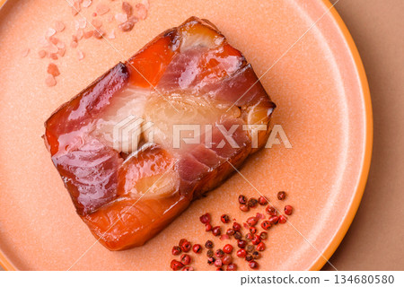 Tuna and salmon roll, smoked fish. Tuna and salmon roll as a food background Tuna and salmon roll, smoked fish. Tuna and salmon roll as a food background 134680580