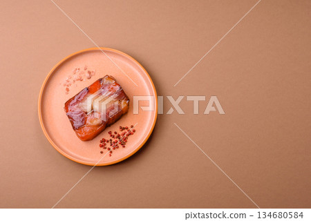 Tuna and salmon roll, smoked fish. Tuna and salmon roll as a food background Tuna and salmon roll, smoked fish. Tuna and salmon roll as a food background 134680584