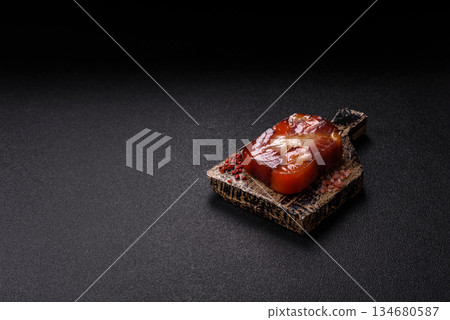 Tuna and salmon roll, smoked fish. Tuna and salmon roll as a food background 134680587