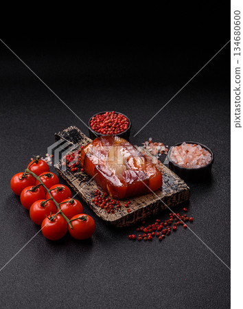 Tuna and salmon roll, smoked fish. Tuna and salmon roll as a food background Tuna and salmon roll, smoked fish. Tuna and salmon roll as a food background 134680600
