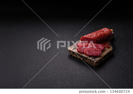 Smoked salami slices, beef or chicken sausage for sandwiches. Salami slices Smoked salami slices, beef or chicken sausage for sandwiches. Salami slices 134680724