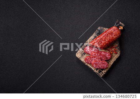Smoked salami slices, beef or chicken sausage for sandwiches. Salami slices Smoked salami slices, beef or chicken sausage for sandwiches. Salami slices 134680725