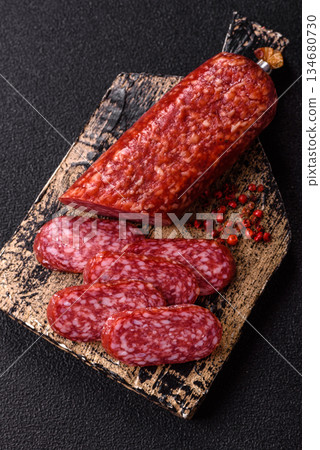 Smoked salami slices, beef or chicken sausage for sandwiches. Salami slices Smoked salami slices, beef or chicken sausage for sandwiches. Salami slices 134680730