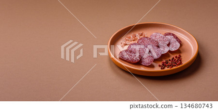 Smoked salami slices, beef or chicken sausage for sandwiches. Salami slices Smoked salami slices, beef or chicken sausage for sandwiches. Salami slices 134680743