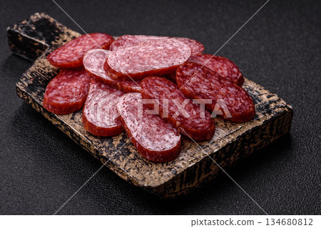Smoked salami slices, beef or chicken sausage for sandwiches. Salami slices Smoked salami slices, beef or chicken sausage for sandwiches. Salami slices 134680812