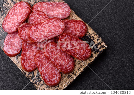 Smoked salami slices, beef or chicken sausage for sandwiches. Salami slices Smoked salami slices, beef or chicken sausage for sandwiches. Salami slices 134680813
