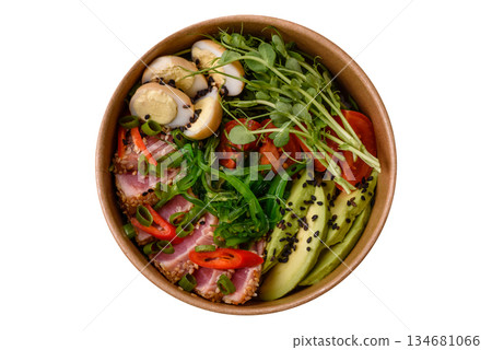Seared tuna tataki in a bowl with sesame seeds, rice, and vegetables. Tuna tataki Seared tuna tataki in a bowl with sesame seeds, rice, and vegetables. Tuna tataki 134681066