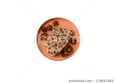 Stollen, a German Christmas pastry for the winter holidays. Stollen as a food background 134681088