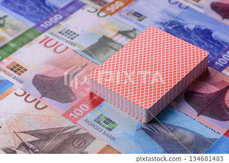 Casino game in the Norway, Norwegian krone money, chips, cards. Gambling in casinos in the Norway Casino game in the Norway, Norwegian krone money, chips, cards. Gambling in casinos in the Norway 134681483
