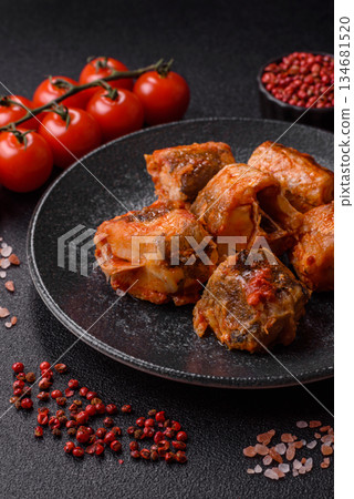 Hake fish cooked in pieces in tomato sauce, stew with peppers and carrots. Hake fish in tomato Hake fish cooked in pieces in tomato sauce, stew with peppers and carrots. Hake fish in tomato 134681520
