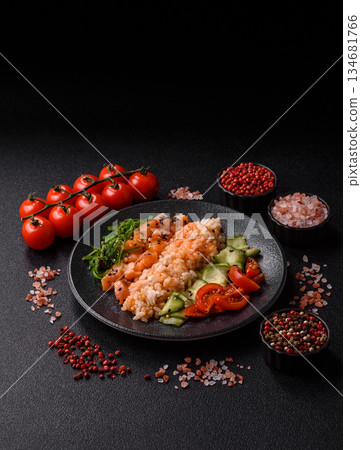 A food bowl with salmon, rice, avocado, tomatoes, and cucumbers. A salmon bowl A food bowl with salmon, rice, avocado, tomatoes, and cucumbers. A salmon bowl 134681766