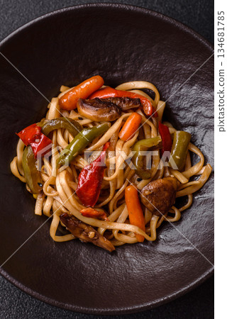 Asian food, noodles with vegetables, vegetarian dish with spicy sauce. Noodles with vegetables Asian food, noodles with vegetables, vegetarian dish with spicy sauce. Noodles with vegetables 134681785