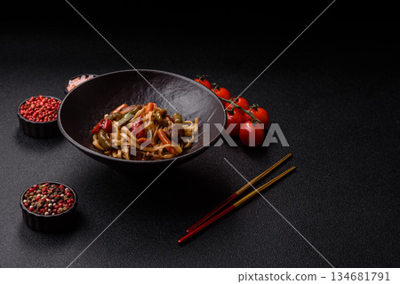 Asian food, noodles with vegetables, vegetarian dish with spicy sauce. Noodles with vegetables 134681791