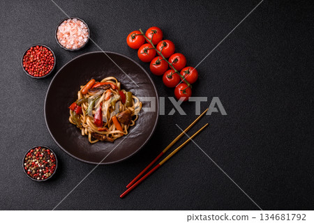 Asian food, noodles with vegetables, vegetarian dish with spicy sauce. Noodles with vegetables Asian food, noodles with vegetables, vegetarian dish with spicy sauce. Noodles with vegetables 134681792