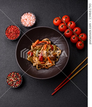 Asian food, noodles with vegetables, vegetarian dish with spicy sauce. Noodles with vegetables Asian food, noodles with vegetables, vegetarian dish with spicy sauce. Noodles with vegetables 134681793