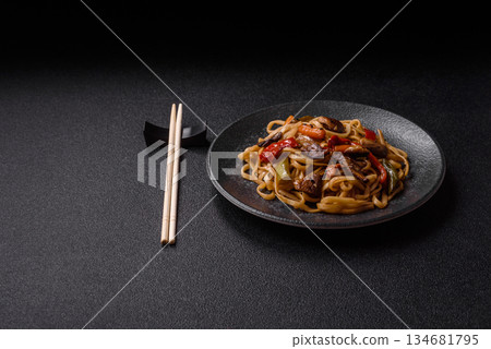 Asian food, noodles with vegetables, vegetarian dish with spicy sauce. Noodles with vegetables 134681795
