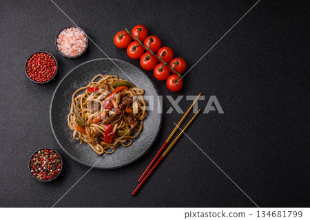 Asian food, noodles with vegetables, vegetarian dish with spicy sauce. Noodles with vegetables Asian food, noodles with vegetables, vegetarian dish with spicy sauce. Noodles with vegetables 134681799