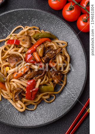 Asian food, noodles with vegetables, vegetarian dish with spicy sauce. Noodles with vegetables Asian food, noodles with vegetables, vegetarian dish with spicy sauce. Noodles with vegetables 134681804