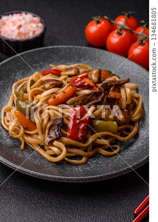 Asian food, noodles with vegetables, vegetarian dish with spicy sauce. Noodles with vegetables Asian food, noodles with vegetables, vegetarian dish with spicy sauce. Noodles with vegetables 134681805