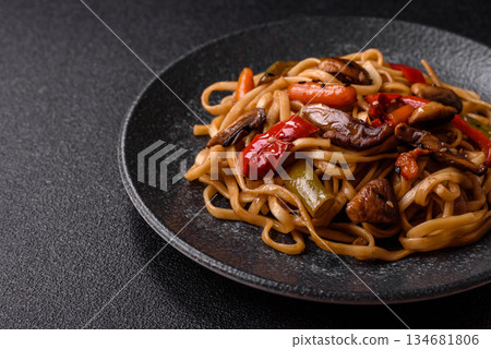 Asian food, noodles with vegetables, vegetarian dish with spicy sauce. Noodles with vegetables Asian food, noodles with vegetables, vegetarian dish with spicy sauce. Noodles with vegetables 134681806