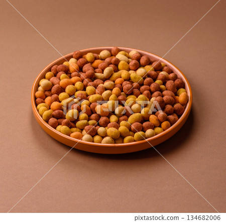 Food, nuts coated with salt and paprika, peanuts as a source of protein. Salted peanuts Food, nuts coated with salt and paprika, peanuts as a source of protein. Salted peanuts 134682006