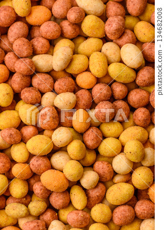 Food, nuts coated with salt and paprika, peanuts as a source of protein. Salted peanuts 134682008