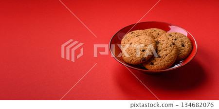 Food, oatmeal chocolate raisin cookies, dessert or breakfast pastry. Oatmeal chocolate cookies 134682076