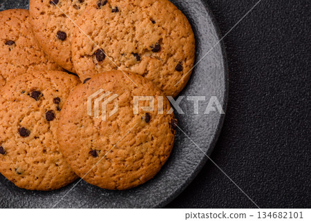 Food, oatmeal chocolate raisin cookies, dessert or breakfast pastry. Oatmeal chocolate cookies Food, oatmeal chocolate raisin cookies, dessert or breakfast pastry. Oatmeal chocolate cookies 134682101
