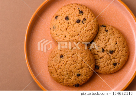 Food, oatmeal chocolate raisin cookies, dessert or breakfast pastry. Oatmeal chocolate cookies Food, oatmeal chocolate raisin cookies, dessert or breakfast pastry. Oatmeal chocolate cookies 134682113