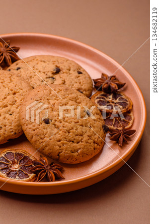 Food, oatmeal chocolate raisin cookies, dessert or breakfast pastry. Oatmeal chocolate cookies Food, oatmeal chocolate raisin cookies, dessert or breakfast pastry. Oatmeal chocolate cookies 134682119