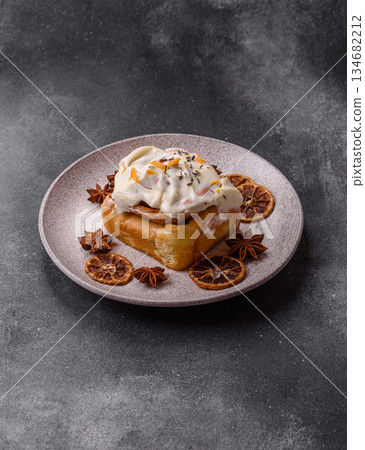 Cinnabon, a sweet cinnamon pastry, a high calorie bun or roll. Cinnabon with cinnamon 134682212