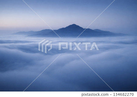 Mountain ridges floating in a sea of clouds 134682270