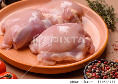 Chicken thigh fillet, skinless and boneless meat for grilling or barbecue. Chicken thigh fillet Chicken thigh fillet, skinless and boneless meat for grilling or barbecue. Chicken thigh fillet 134682514
